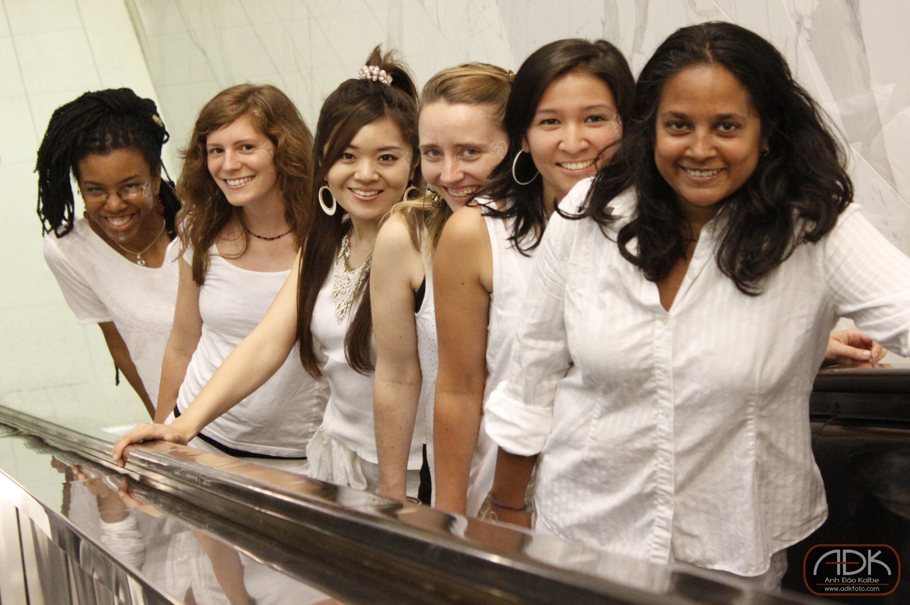 Zili Misik members, riding up an elevator and smiling