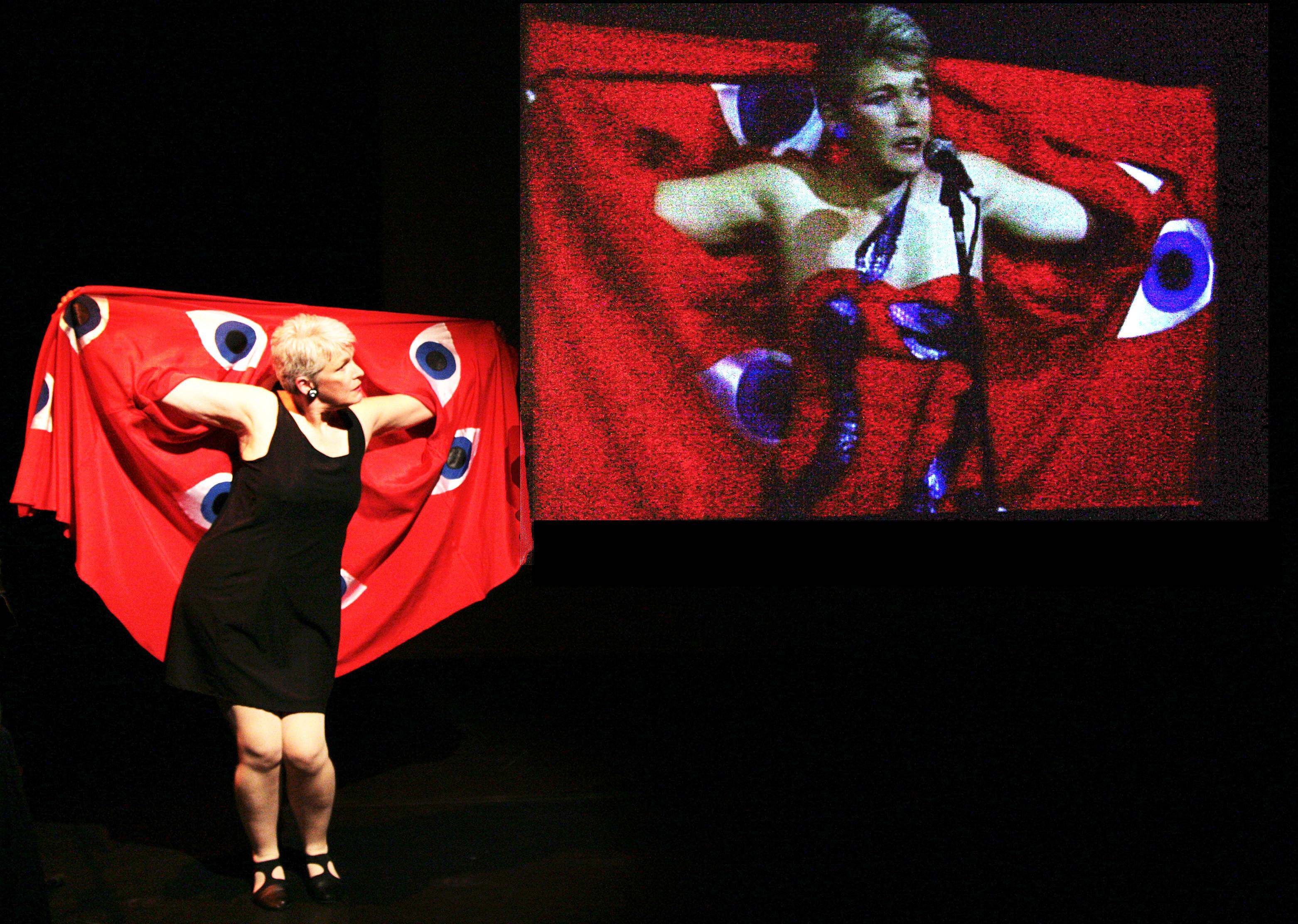 Janice Perry a.k.a. Gal looking at and reflecting her own image on a large screen