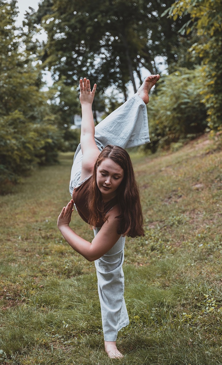 Dancer in a penche with leg in an attitude