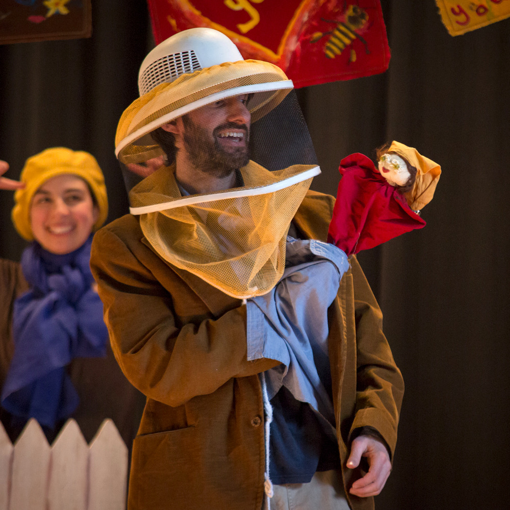Jonathan Mirin holding heart puppet with bee veil