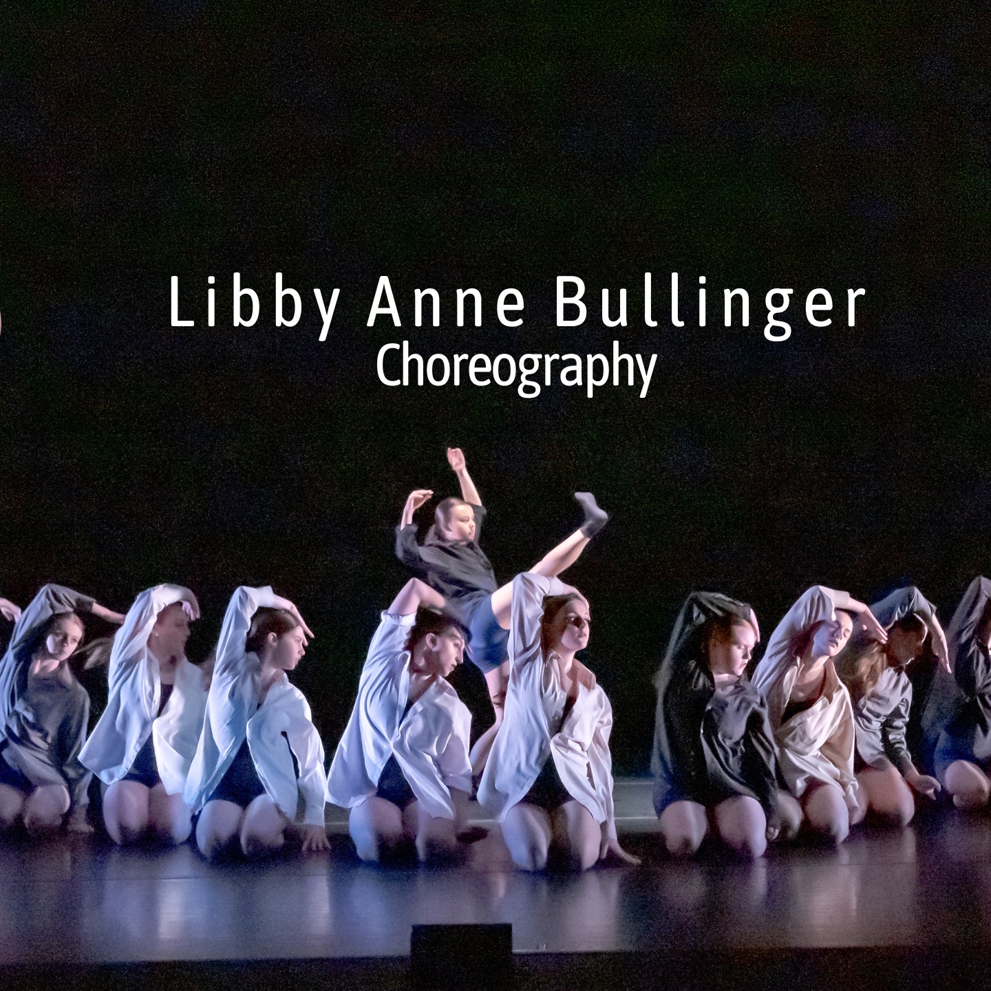 Group of dancers sitting in V formation on floor, single dancer standing behind them, text above says "Libby Anne Bullinger Choreography"