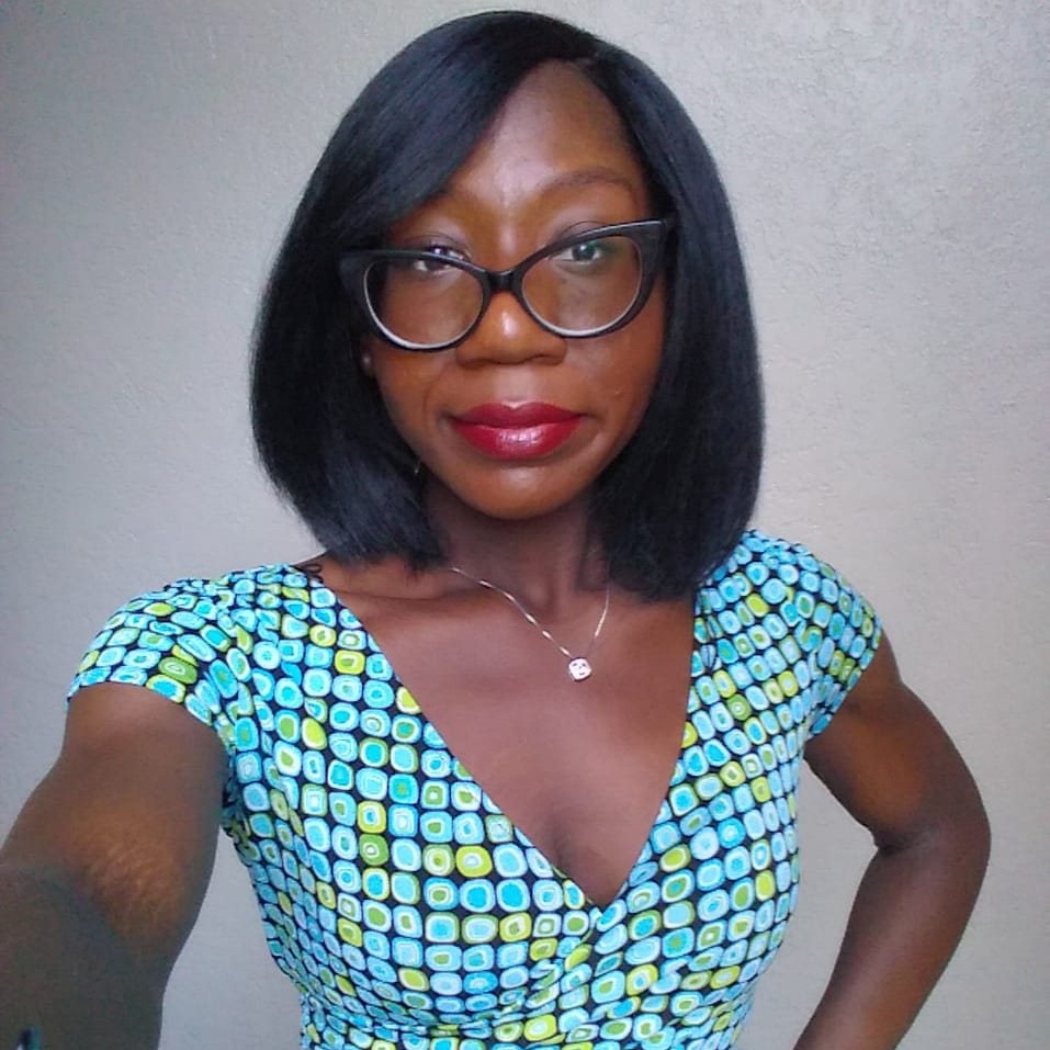 Regine Jackson Profile Photo, Black Woman With Glasses, wearing a blue dress