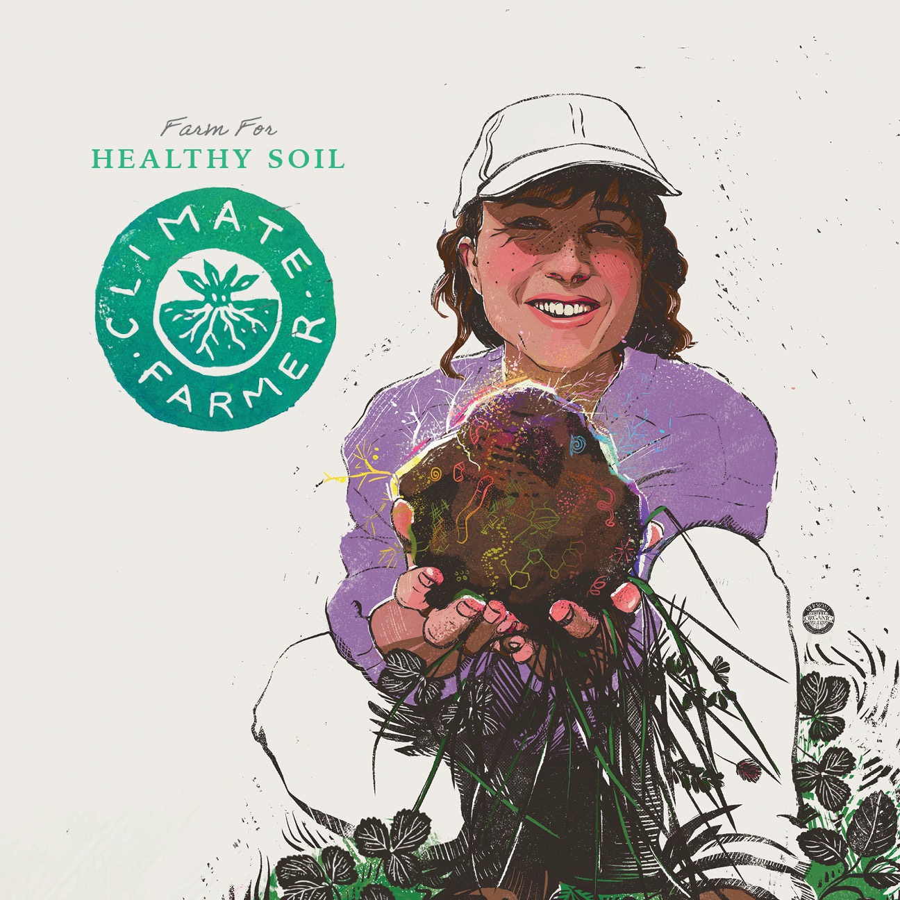 A farmer holds up soil teeming with life