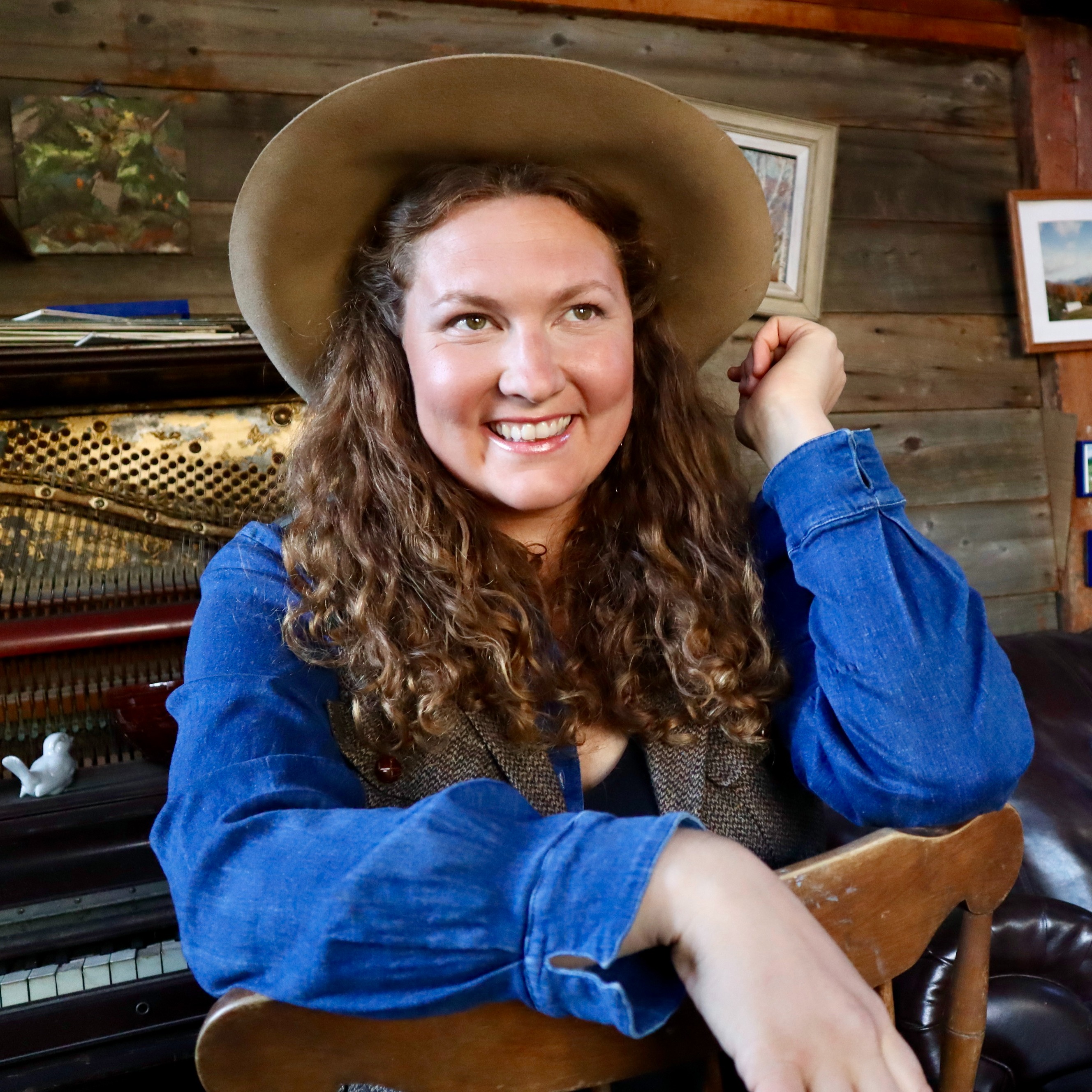 Ida Mae Specker in a denim shirt and beige cowboy hat