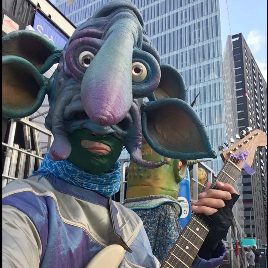 Space Alien Guitarist 4 ears, all blue, very long nnose