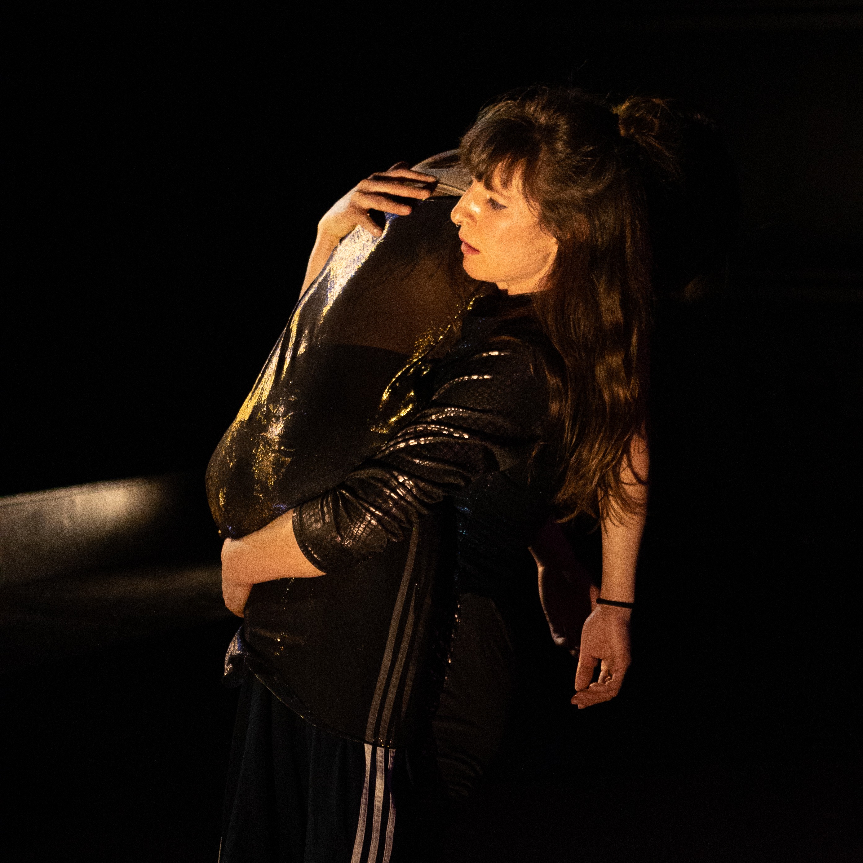 Madison carries a person over her shoulder