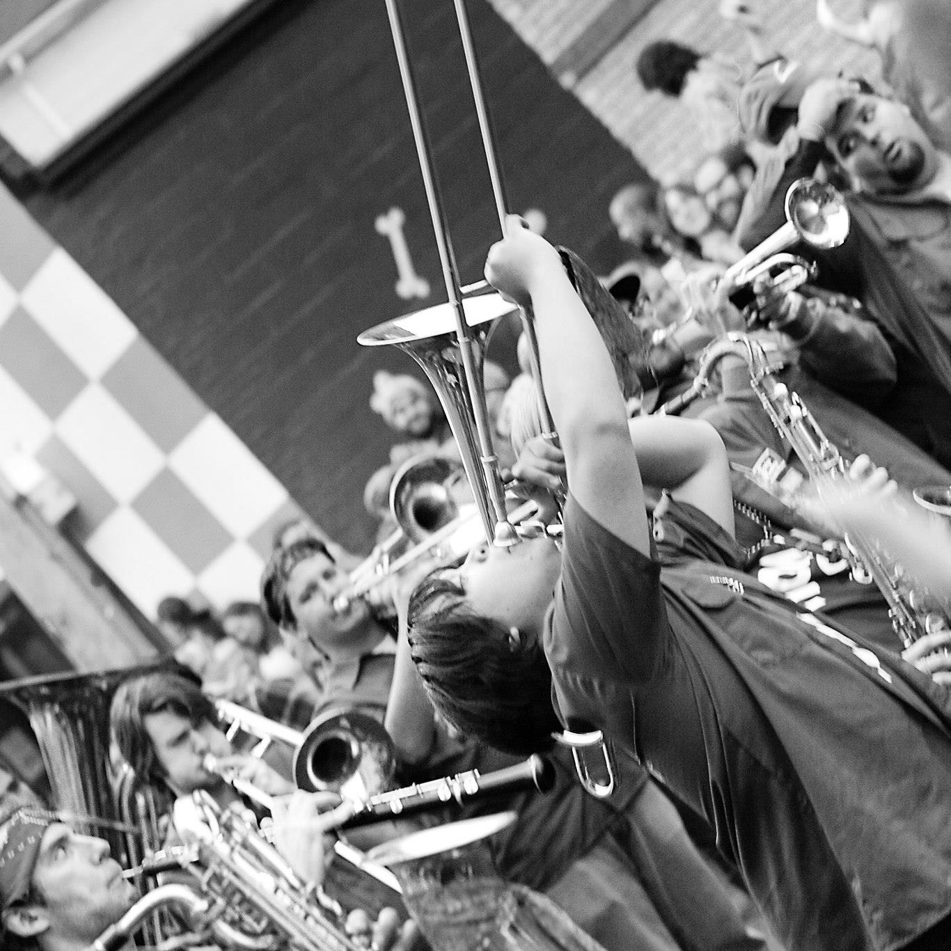 black and white close up tombone player