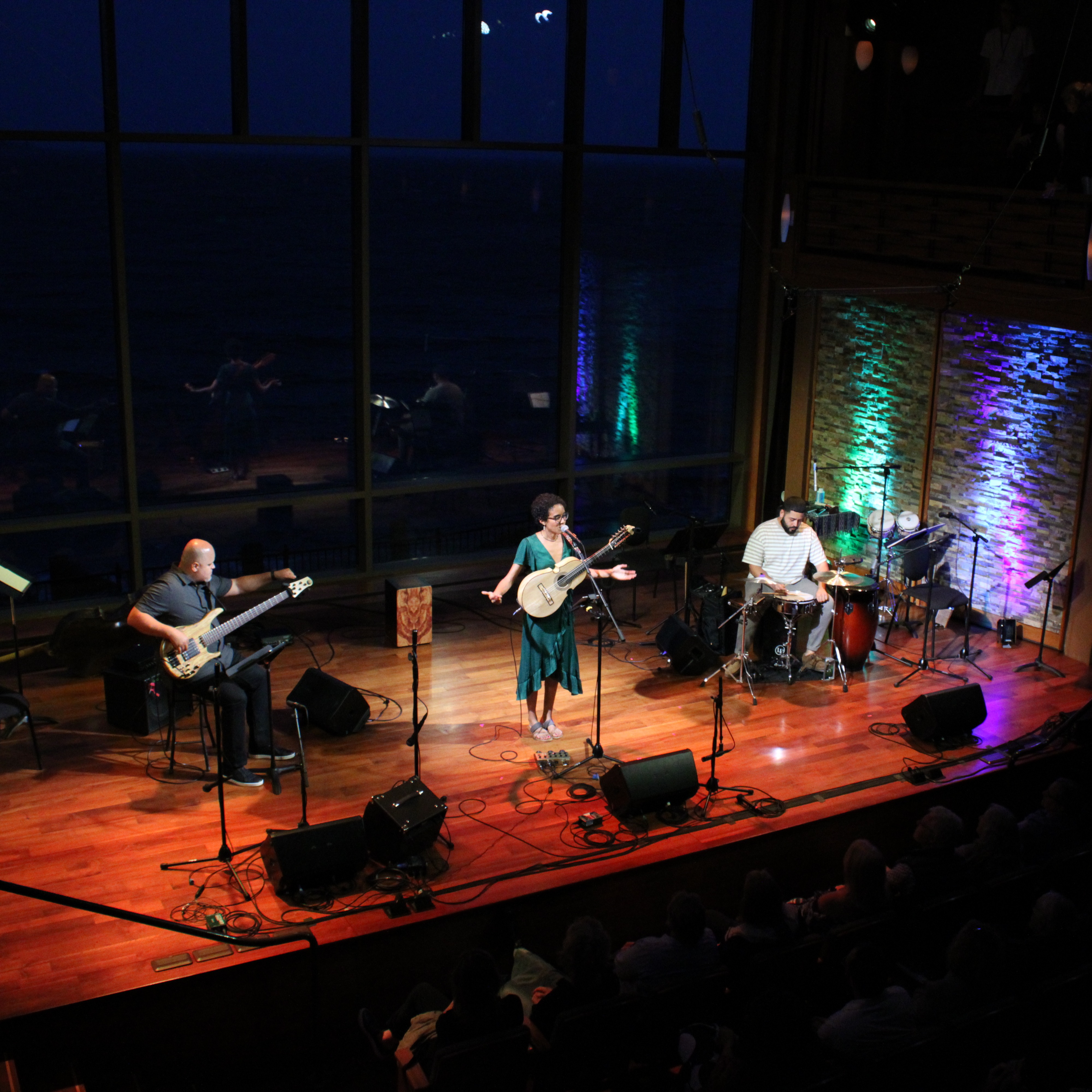 Image shows Fabiola and her trio on stage at Shalin Liu Performance Hall