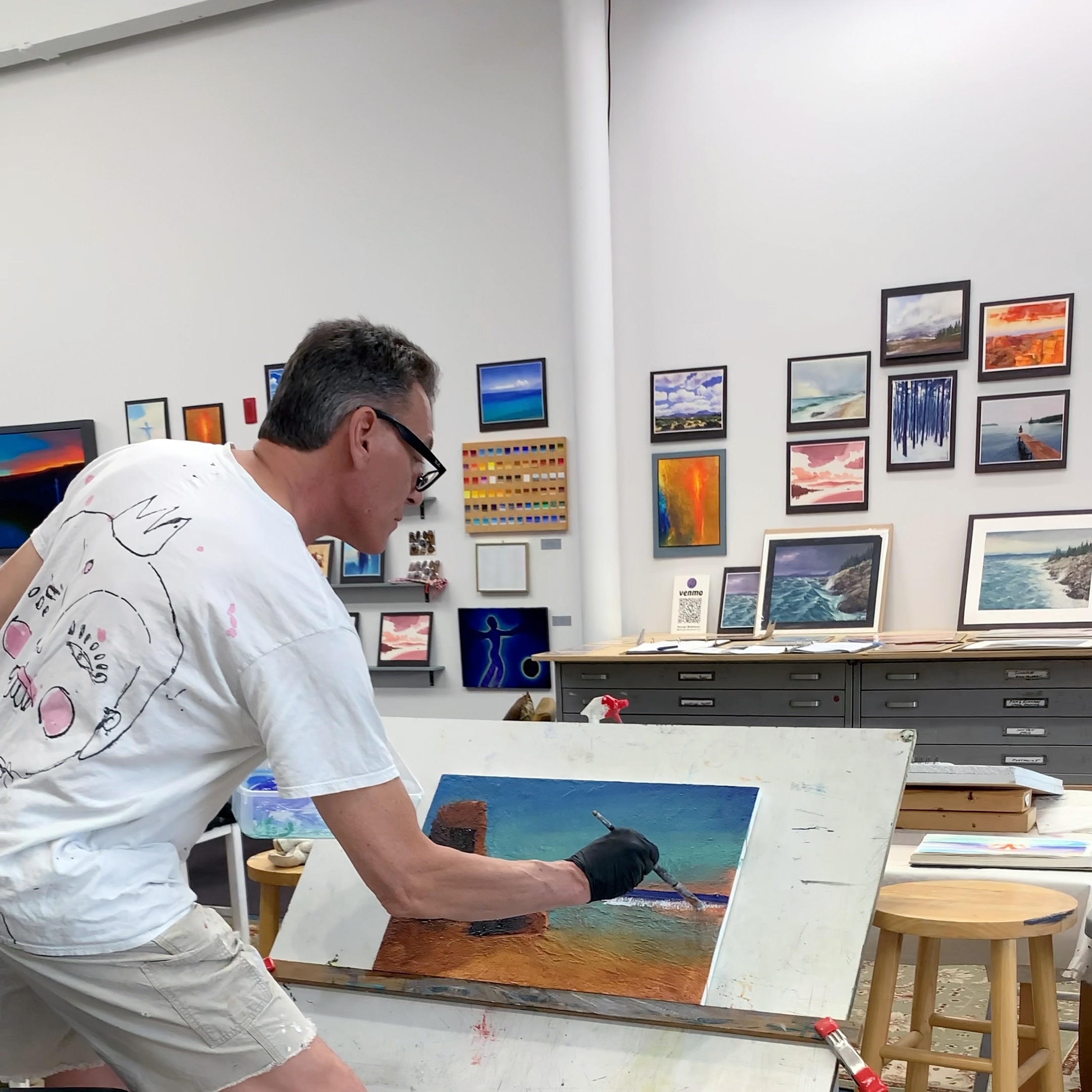 George Middleton painting a seascape demonstration in his studio during Open Studios at Western Ave.