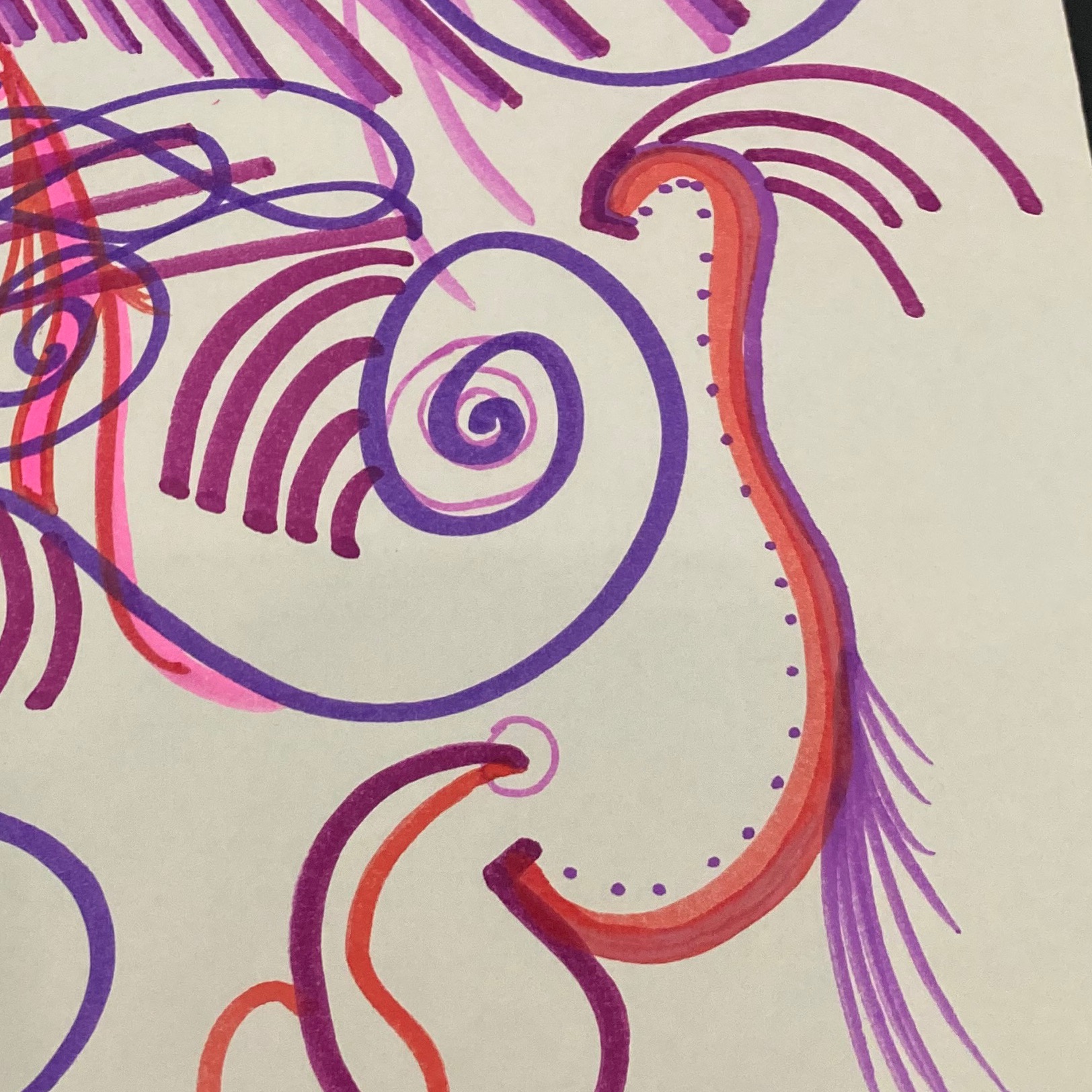 Swirls, polka dots and lines of pink, purple and red