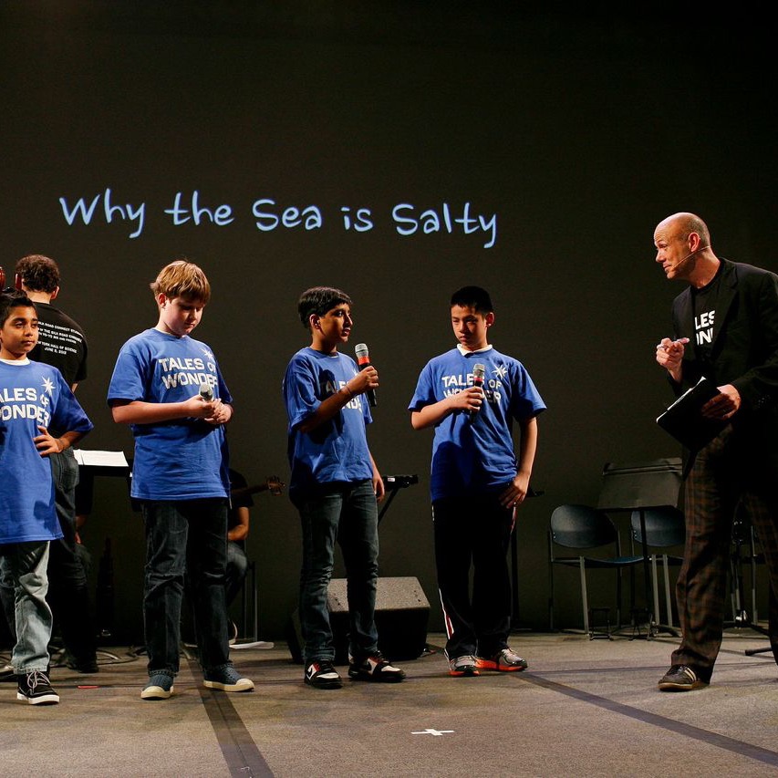 students in blue perform Why the Sea is Salty