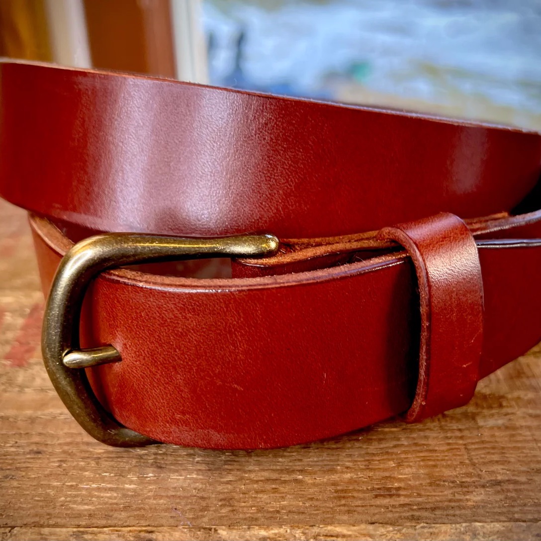 A tan rugged leather belt for all occasions