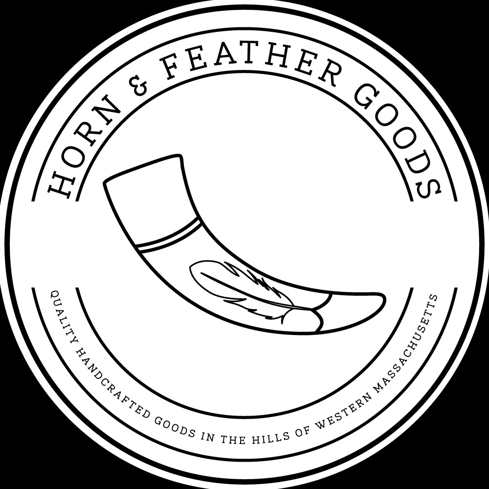 Circular logo with a viking drinking horn centered featuring the name Horn and Feather Goods in text above and the tagline Quality Handcrafted goods in the hills of Western Massachusetts below.