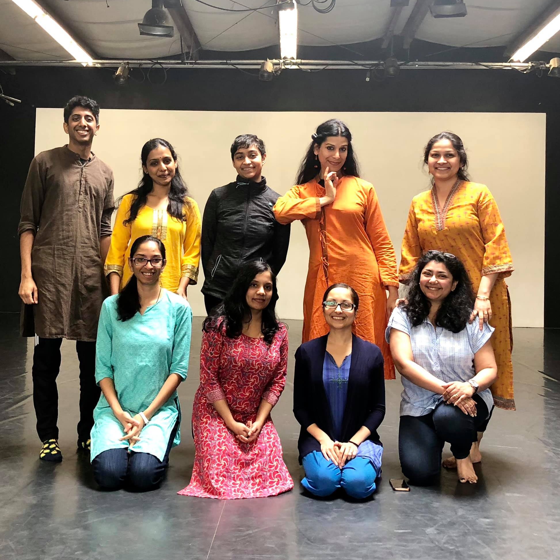 Group of people in front of a white screen