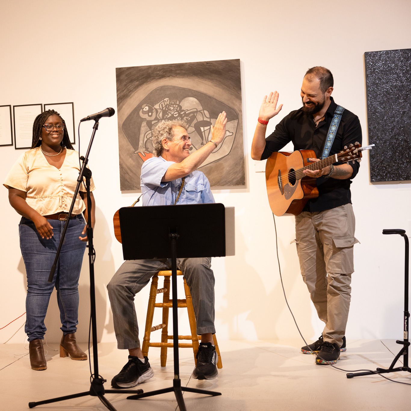 Musicians on stage having a good time during our open mic night