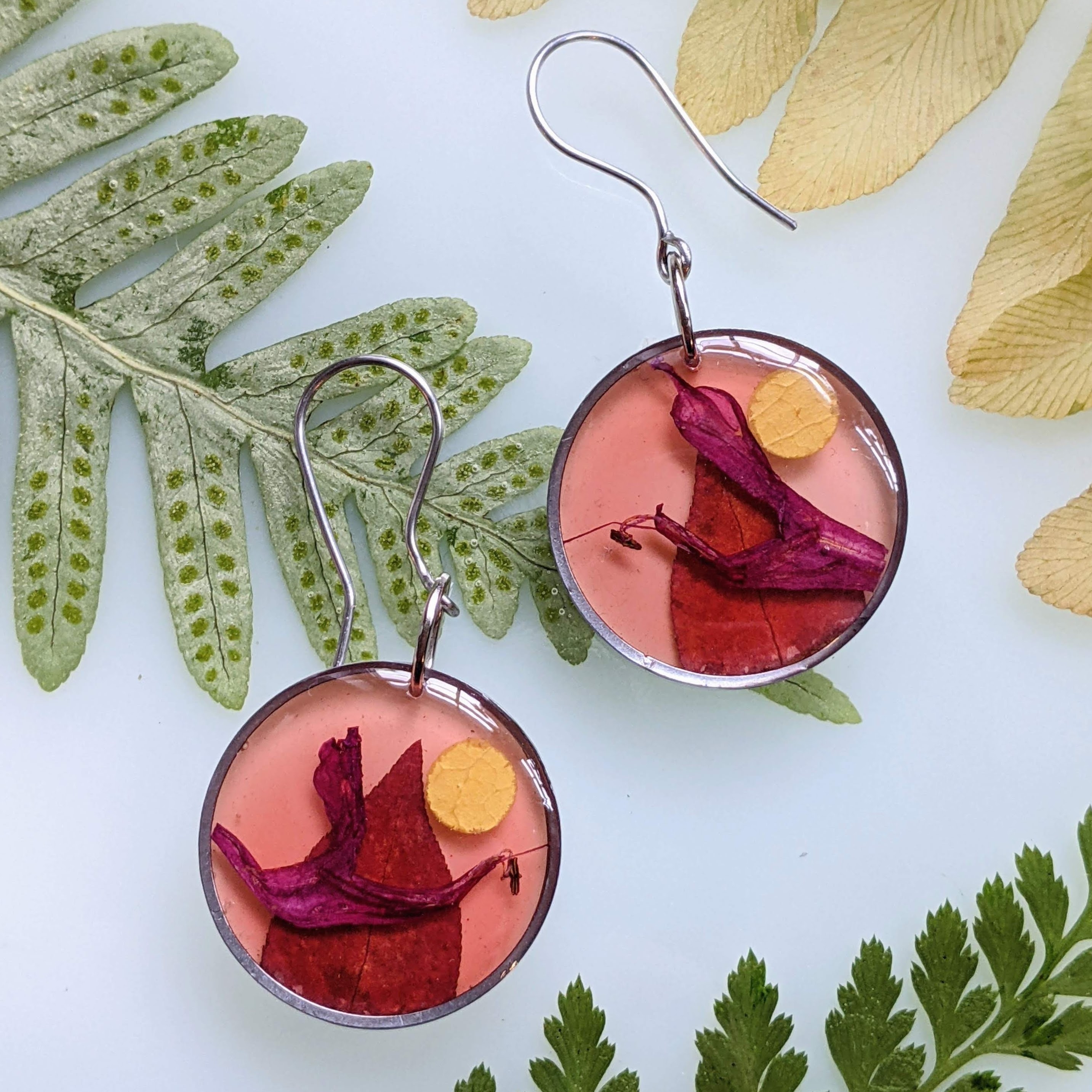 Earrings with Bee balm petals representing cranes flying at sunset