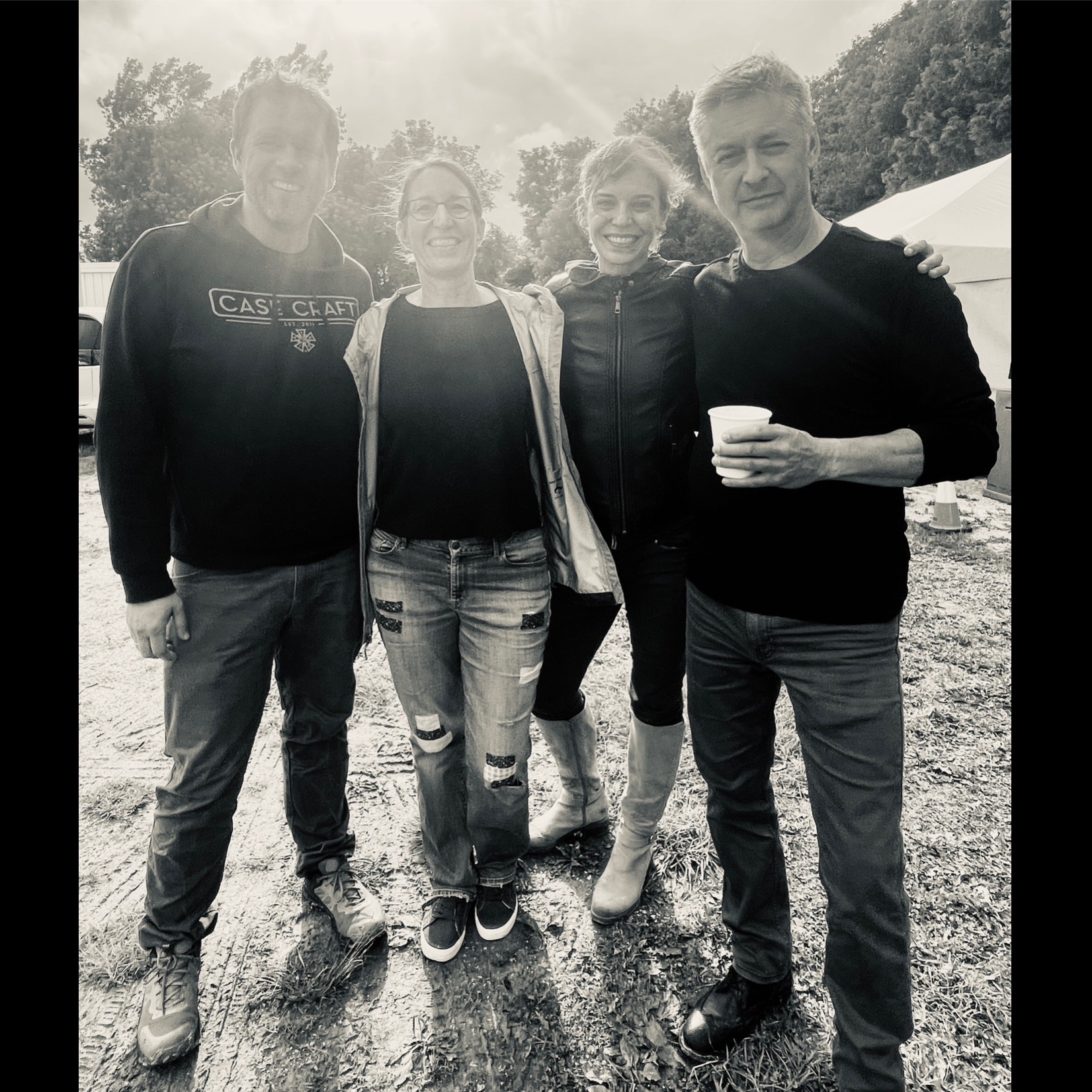 The photo captures the four members of Skylark illuminated by background sun, moments before taking the stage at the Shelburne Museum with Guster.