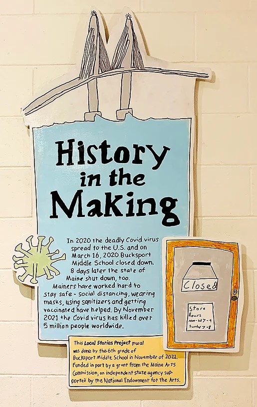 A student-drawn wall mural about Covid titled "History in the Making"