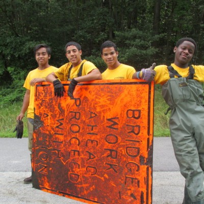 Youth in summer program, during Concord River clean-up