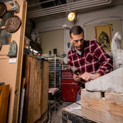 Jay Hungate (sculptor) working in their studio.