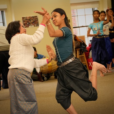 Neakru Phousita Huy training her young pupil the fine techniques of Khmer classical ballet.